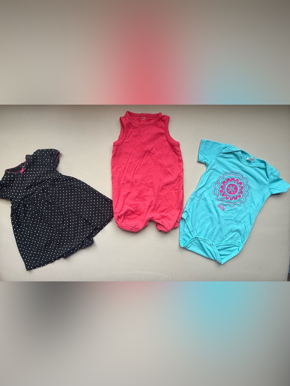 Bundle of 3 One-Piece Bodysuit - Coral, blue and black with white dots.